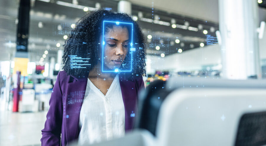 Woman looking at digital signage with AI facial recognition