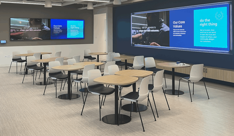 Office breakroom with corporate digital signage branding and messaging